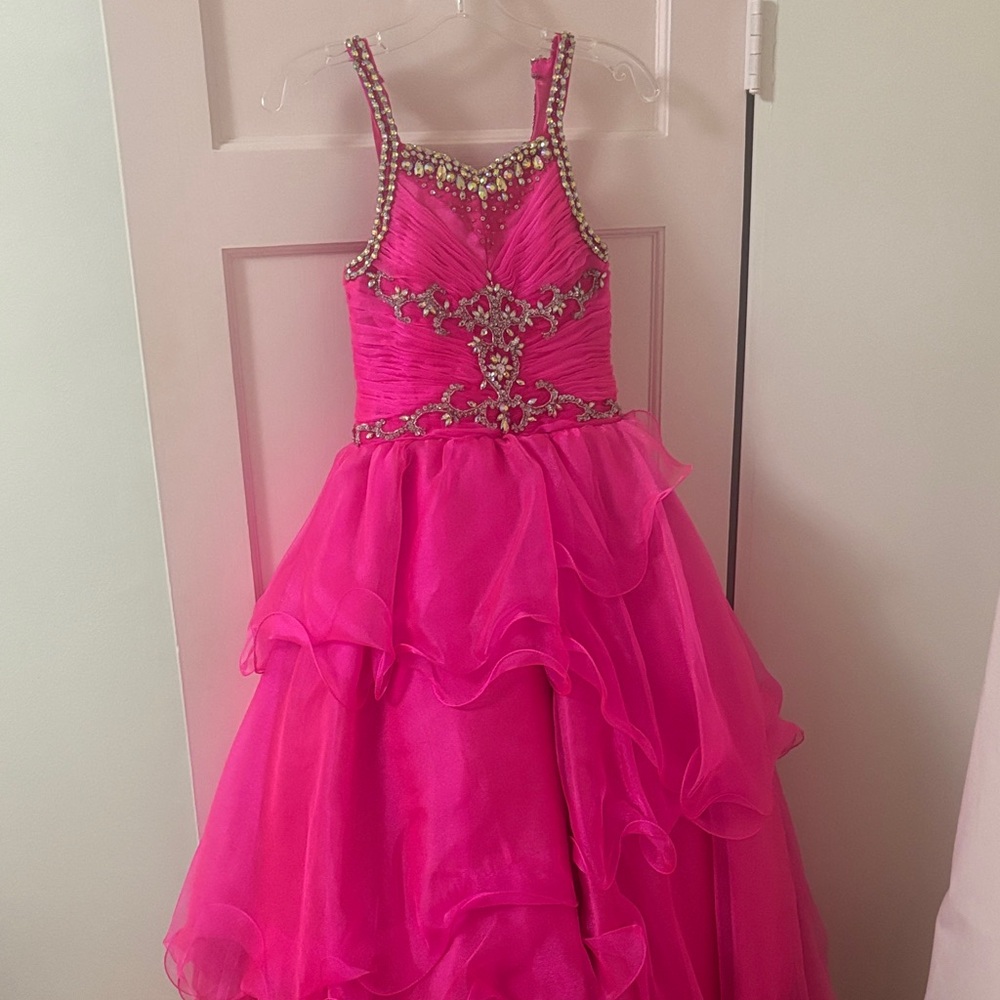 Pink embellished pageant dress with ruffles